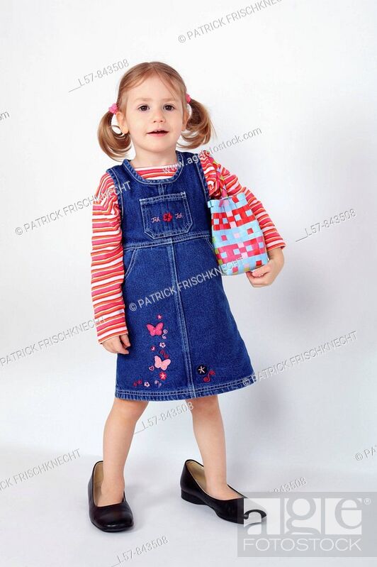toddler, little girl, wearing dress and grown up dress shoes, standing