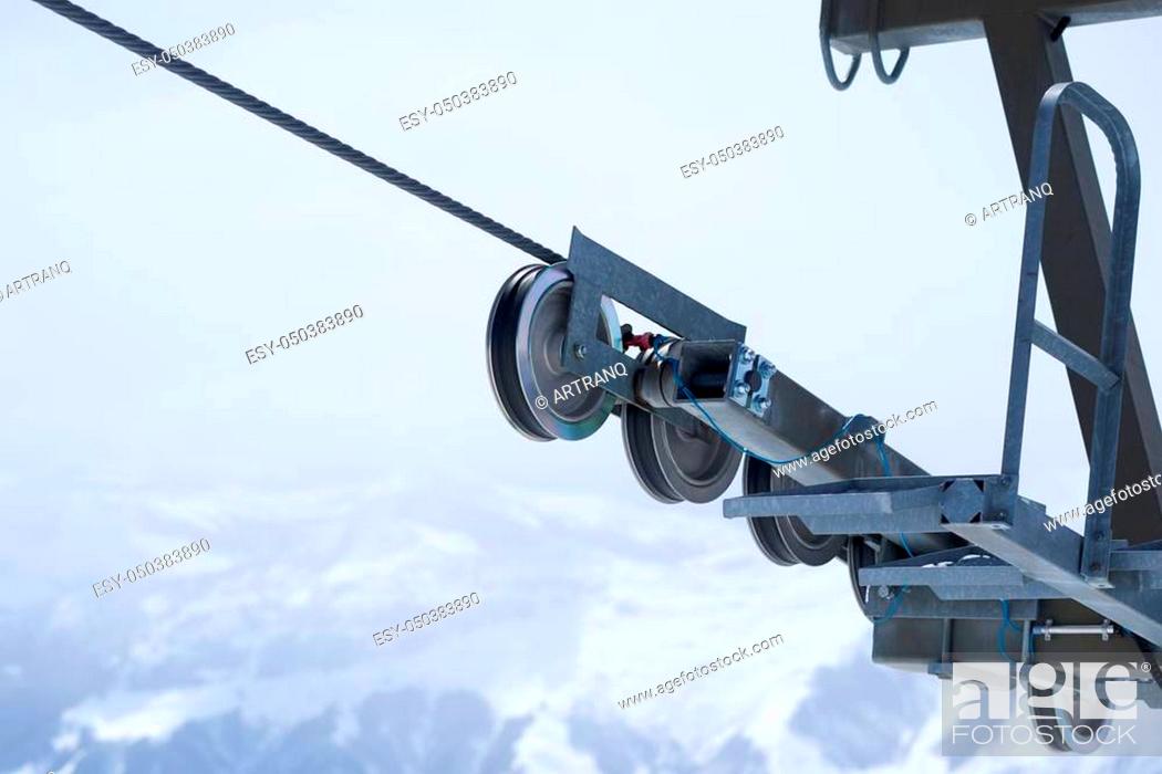 Stock Photo: mechanism rolls cableway support in the mountains winter.