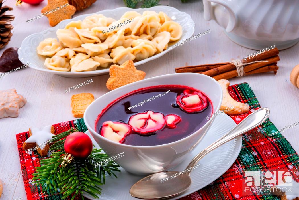 Stock Photo: Barszcz (beetroot soup) with small pierogi.