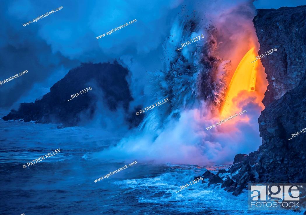 Stock Photo: A Lava fall pours from a lava tube 60 feet high, the heat and pressure of super heated ocean steam creates powerful explosions, Hawaii Volcanoes National Park.
