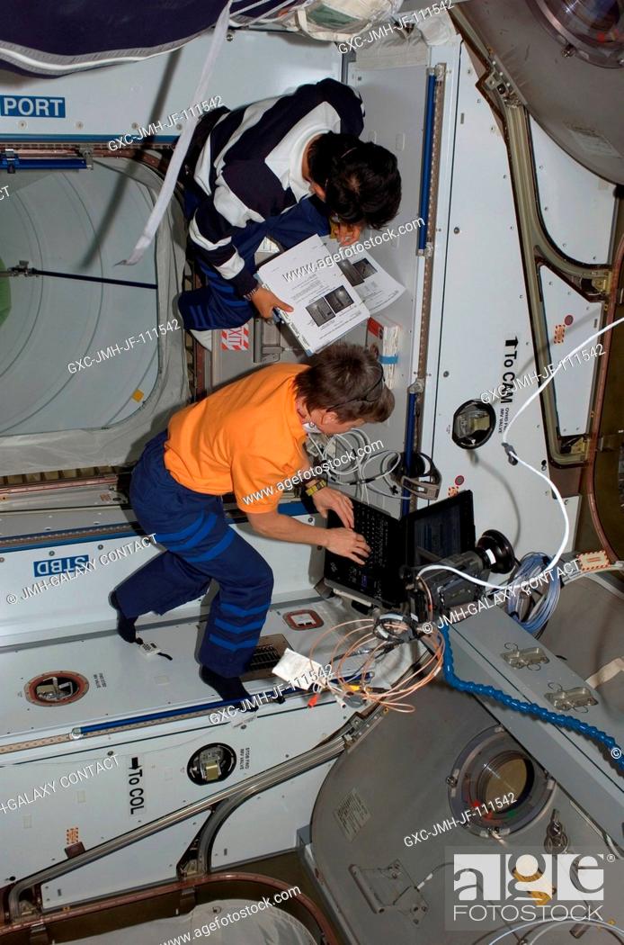 Stock Photo: A high angle view shows astronaut Peggy Whitson, Expedition 16 commander, and Japan Aerospace Exploration Agency (JAXA) astronaut Takao Doi.