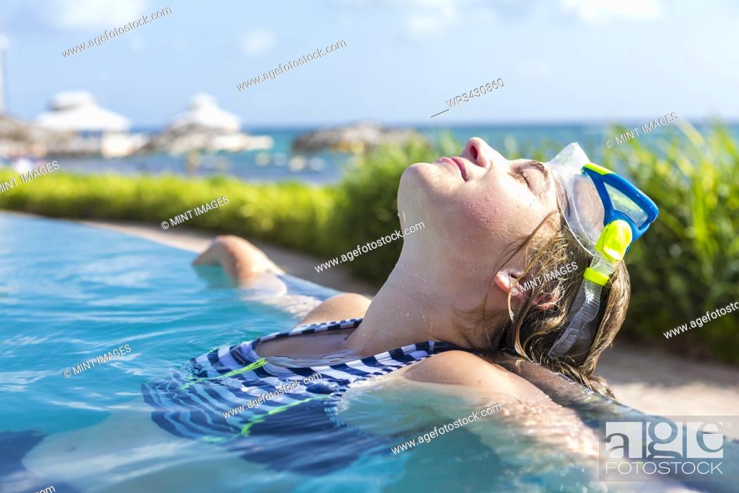 13 year old girl in infinity pool, Stock Photo, Picture And Royalty Free  Image. Pic. WR3430860 | agefotostock