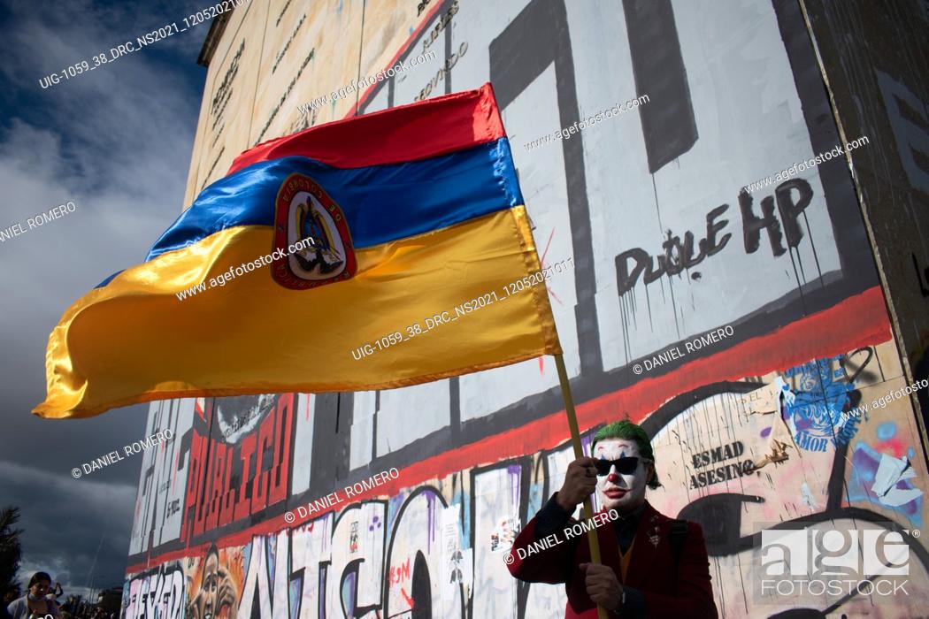 Stock Photo: Protesters with Colombian flags, participate in the fourteenth day of protests in the context of the national strike called by social sectors against the.
