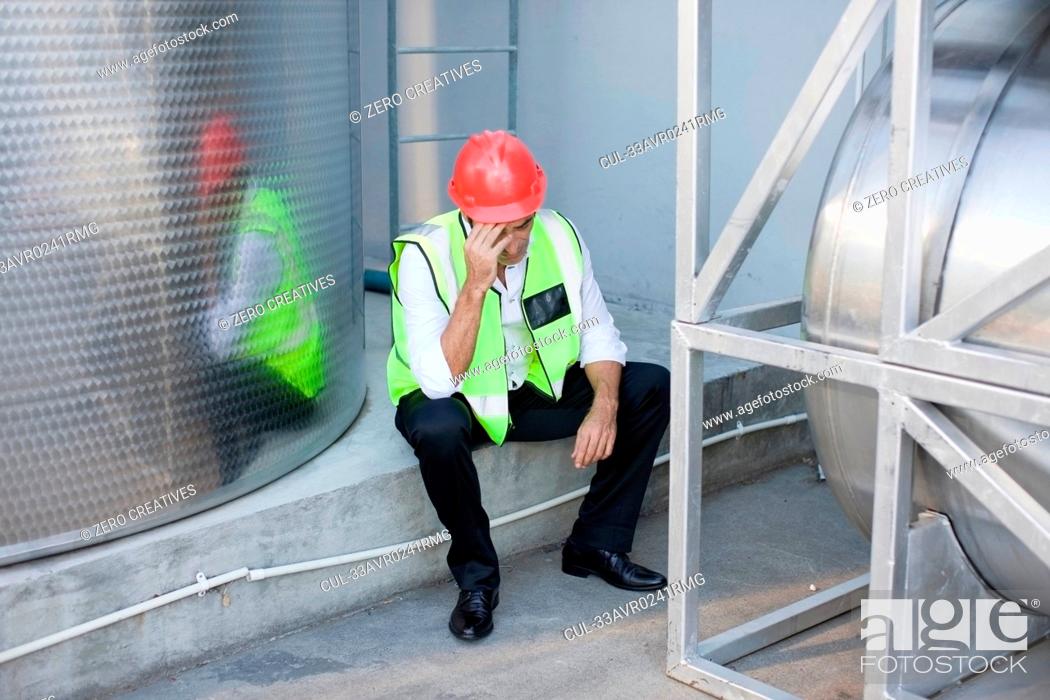 Stock Photo: Exhausted work resting at factory.