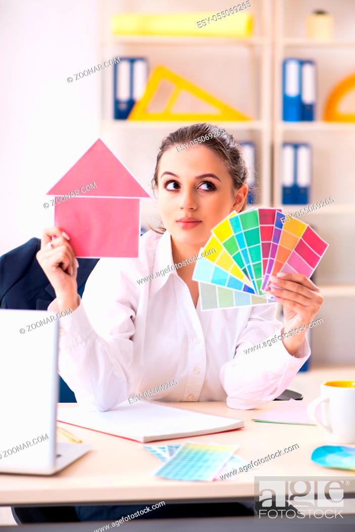 Stock Photo: Female beautiful designer working in the office.