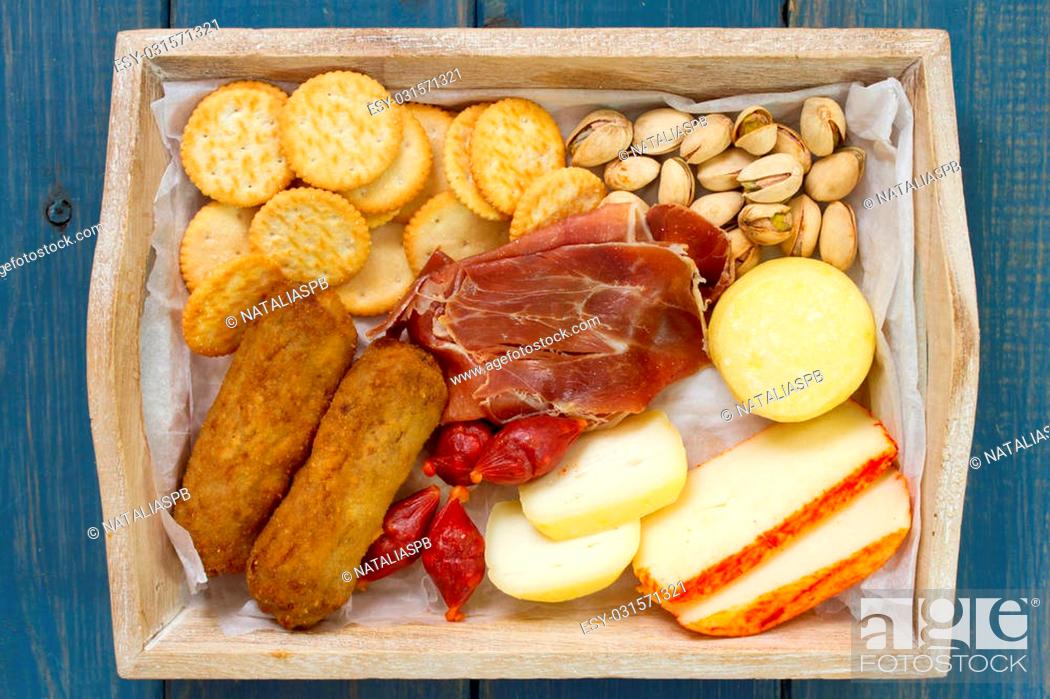 Stock Photo: cheese with cookies and meat croquete.