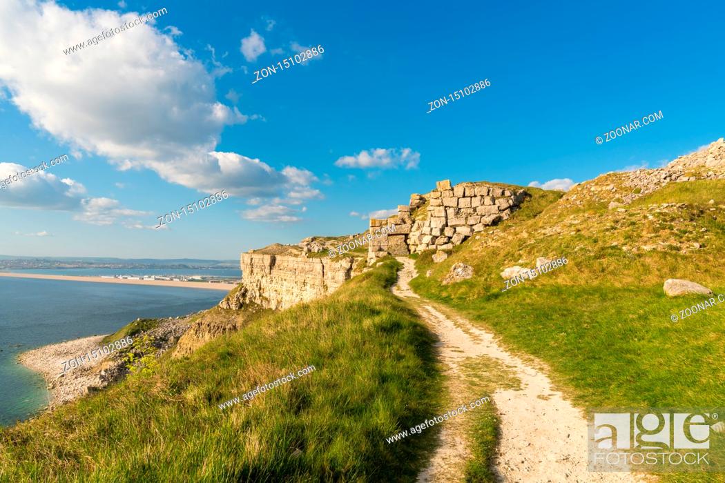 Stock Photo: South West Coast Path on the Isle of Portland, looking towards Fortuneswell and Chesil Beach with Weymouth in the background, Jurassic Coast, Dorset, UK.