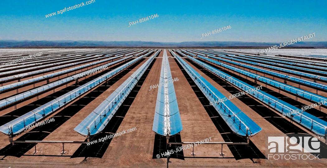 Stock Photo: A view of a field of parabolic dishes in Quarzazate, Morocco, 11 November 2016. The solar thermal energy power plant currently being constructed in desert.