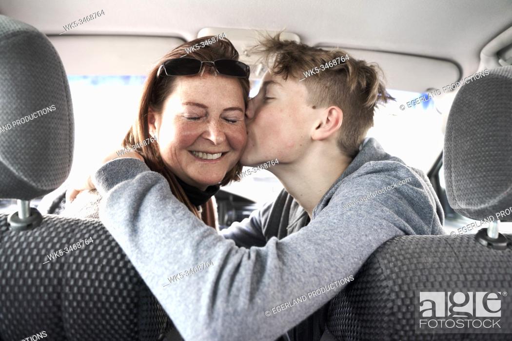 Stock Photo: Teen boy with his mother in car, in Gaissach, Bavaria, Germany.