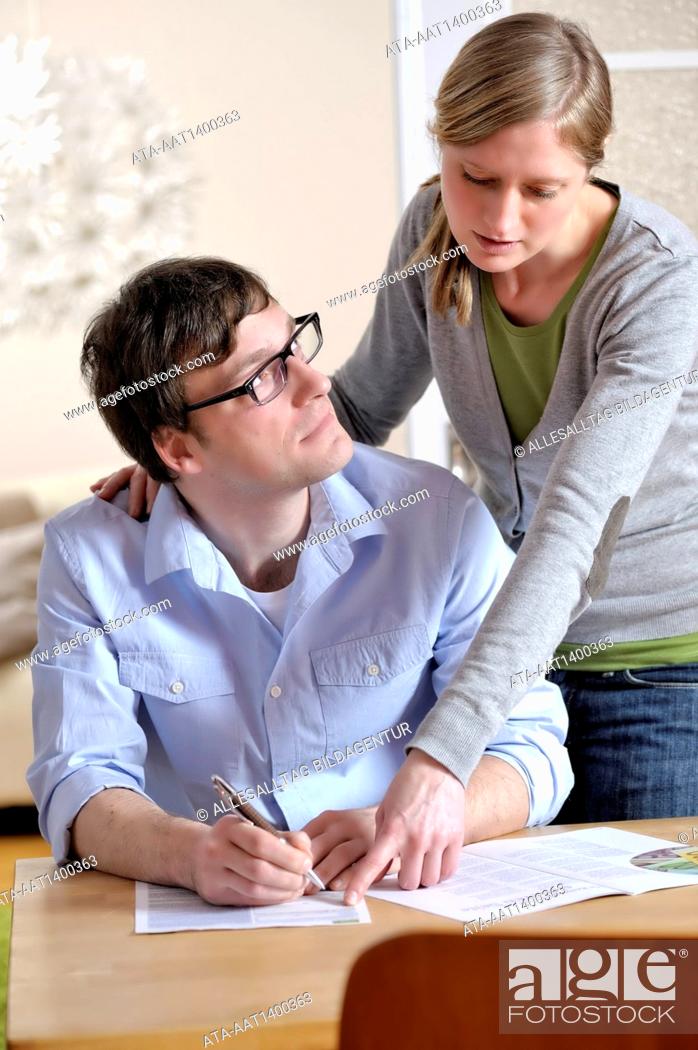 Stock Photo: Couple with documents.
