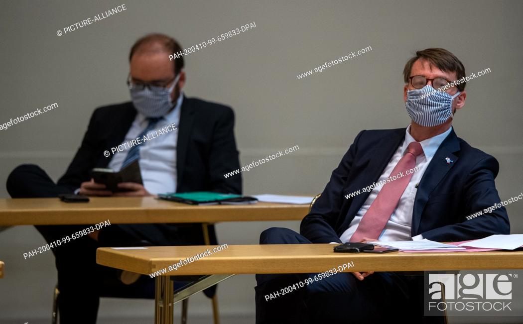 Stock Photo: 09 April 2020, Saxony, Dresden: Roland Wöller (CDU, right), Minister of the Interior of Saxony, and Christian Piwarz (CDU), Minister of Culture of Saxony.