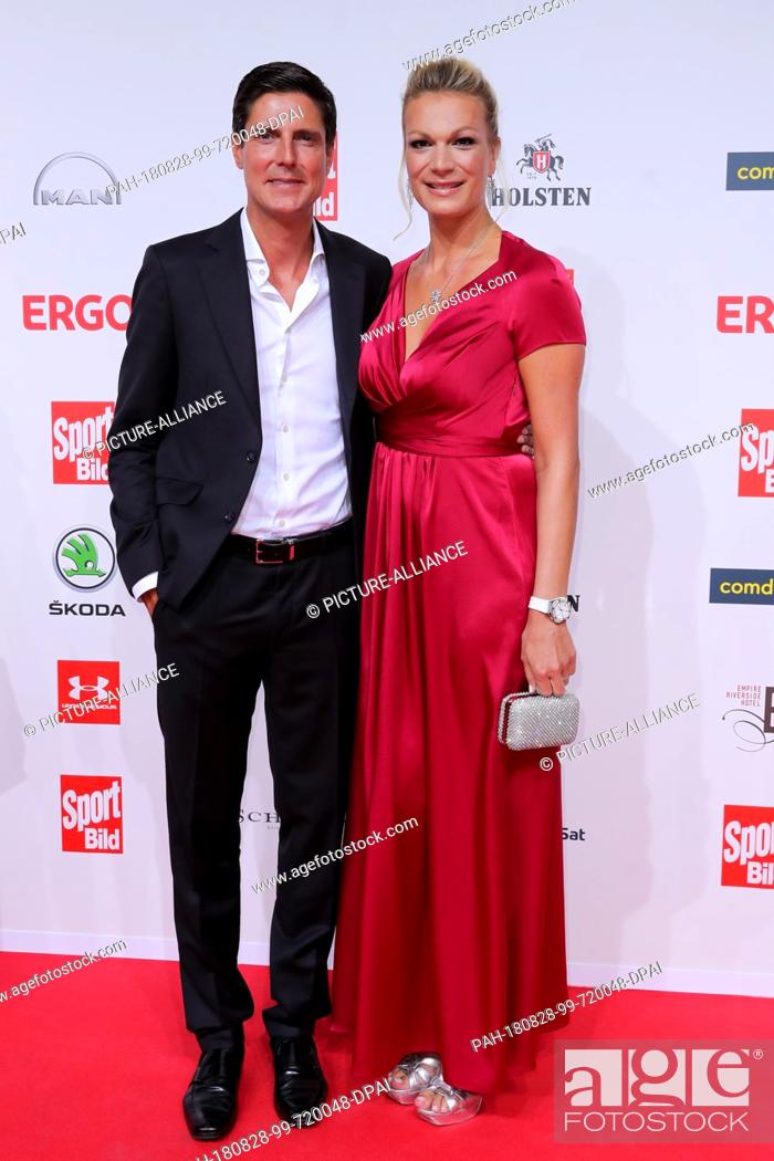Stock Photo: 27 August 2018, Hamburg, Germany: Maria Hoefl-Riesch, former German ski racer, and her husband Marcus Höfl attend the presentation of the ""Sport Bild Award.