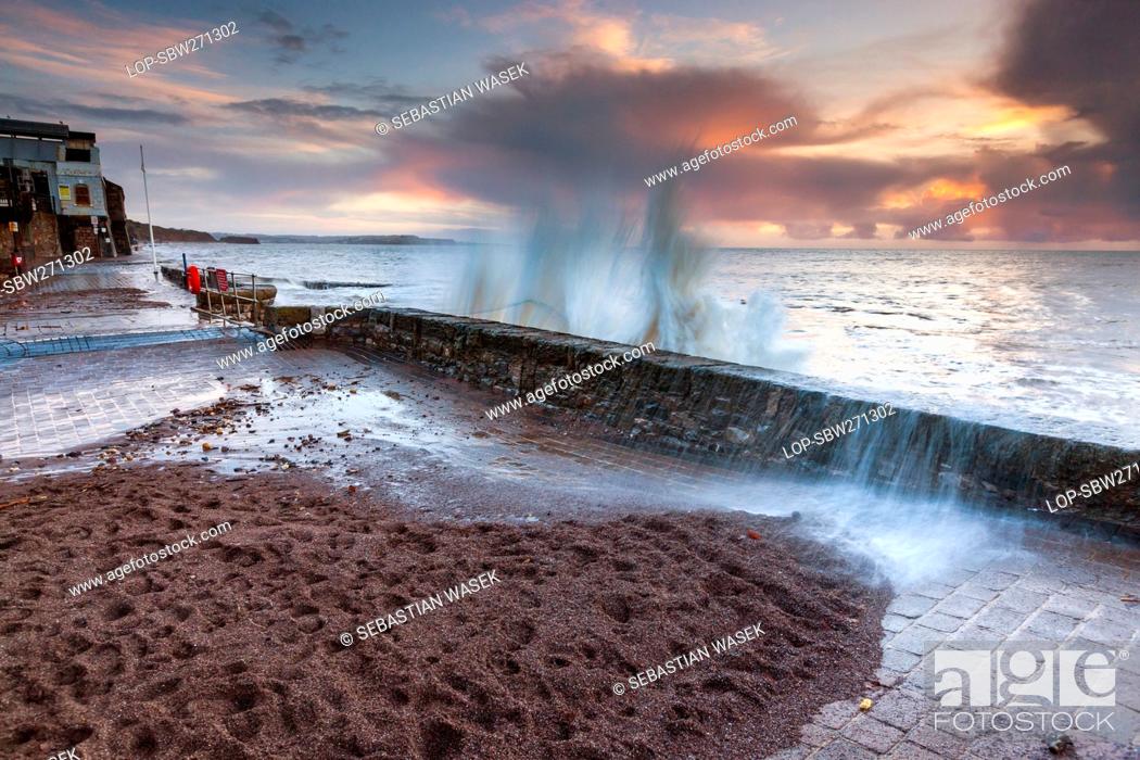 Stock Photo: England, Devon, Dawlish. Waves pounding the sea wall at Dawlish.