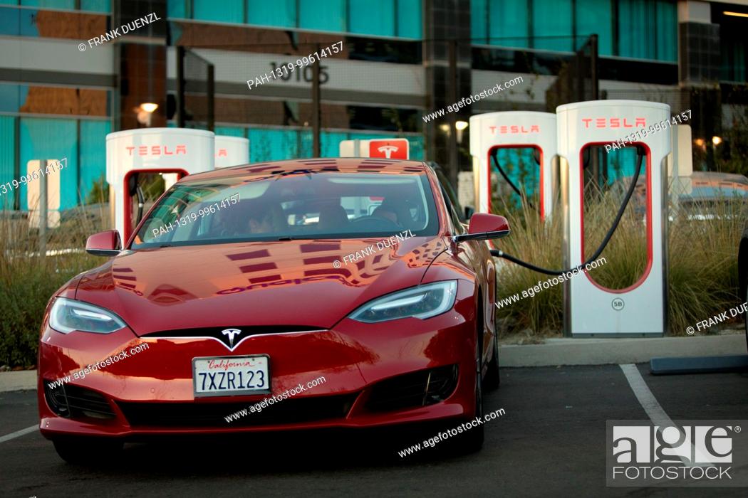 Stock Photo: Tesla charging at the Supercharger at the Qualcomm parking lot in Sorrento Valley, where many high tech, biotech, and IT companies are located, in Febuary 2018.