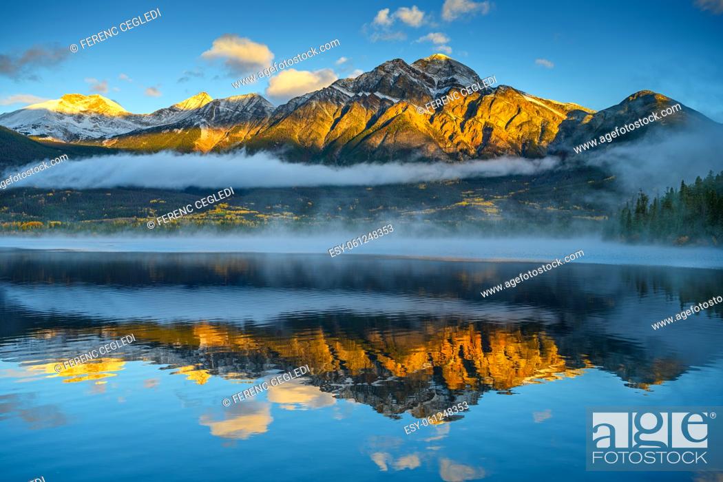 Stock Photo: Gorgeous sunrise over the Pyramid Mountain that is beautifully reflecting in the Pyramid Lake in Jasper National Park, Alberta, Canada.