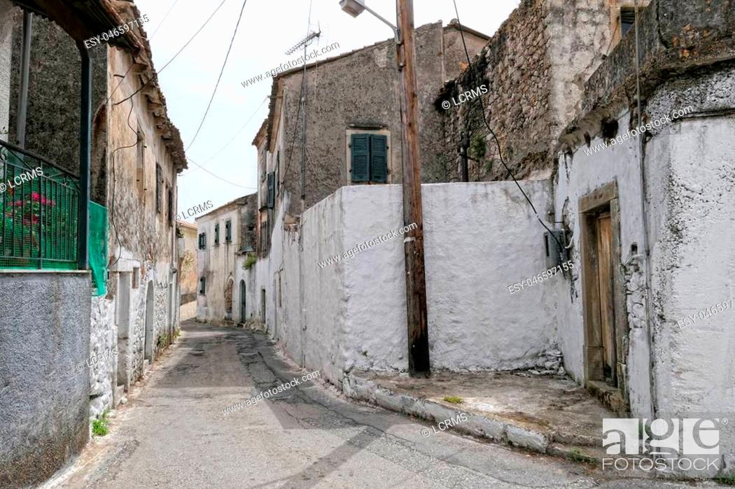 Stock Photo: Cityscape of traditional mountain village Liapades at Corfu Island (Greece). View through the streets.