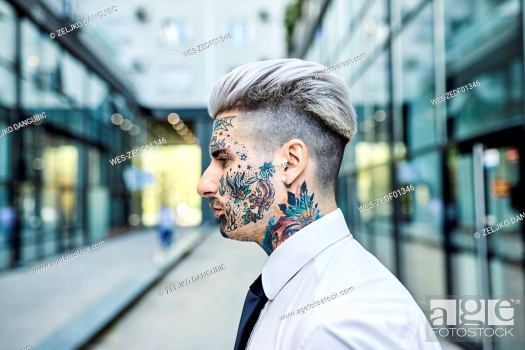 Young businessman with tattooed face, portrait, Stock Photo, Picture And  Royalty Free Image. Pic. WES-ZEDF01346 | agefotostock