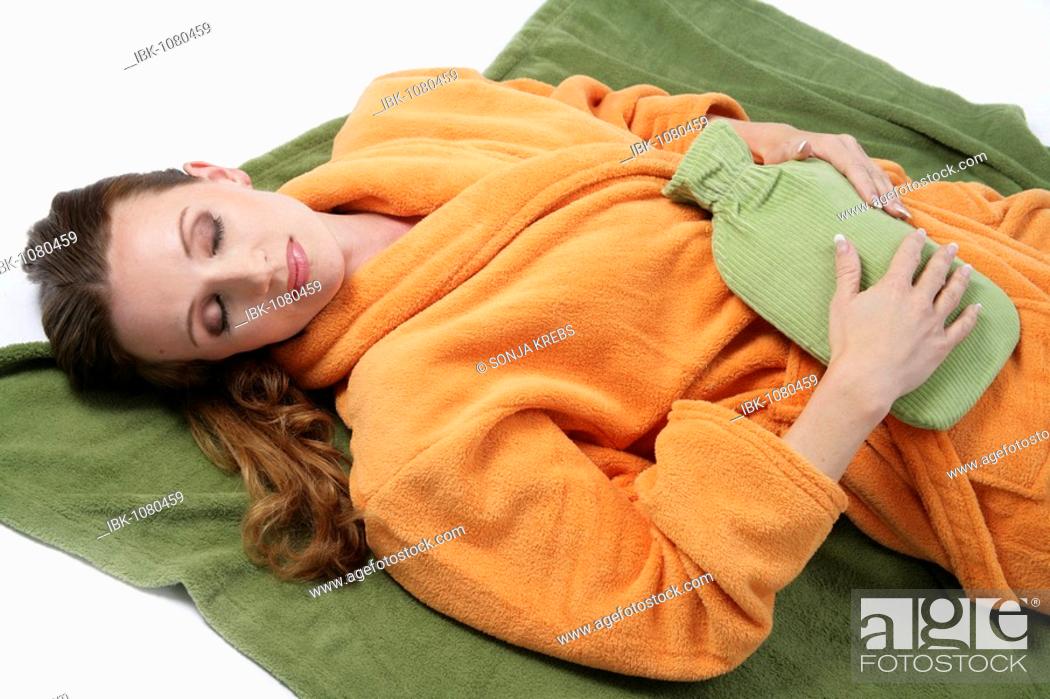 Stock Photo: Woman with a hot-water bottle.