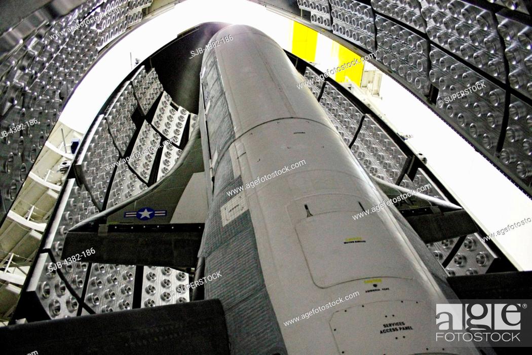Stock Photo: The X-37B Orbital Test Vehicle in the encapsulation cell at the Astrotech facility in Titusville, Florida. The X-37B launched April 22, 2010.