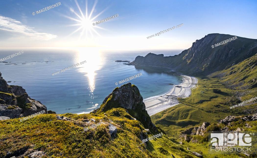 Stock Photo: Sun shining over the sea, cliffs, beach and sea, hiking to the mountain Måtinden, near Stave, Nordland, Norway, Europe.