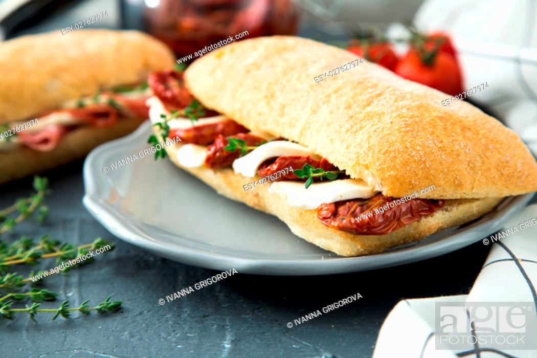 Stock Photo: assorted sandwiches. sandwich Caprese with mozzarella and sun-dried tomatoes and ciabatta with ham.