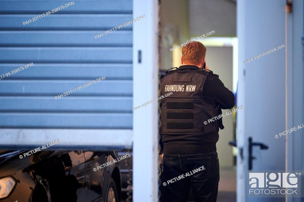 Stock Photo: 17 November 2020, North Rhine-Westphalia, Cologne: An investigator is standing in a building on the grounds of the property at 145 Oskar Jäger Strasse during a.