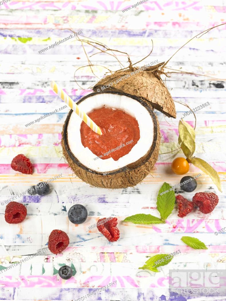Stock Photo: smoothie de coco y frutos rojos / Coconut and red berries smoothie.