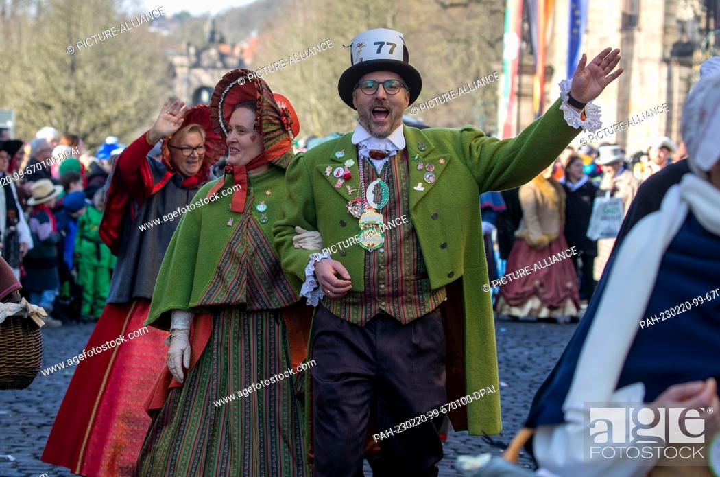 Stock Photo: 20 February 2023, Hesse, Fulda: In historical costumes, fools take part in Hesse's largest carnival parade in Fulda. Under the motto ""Fölsch Foll hinein.