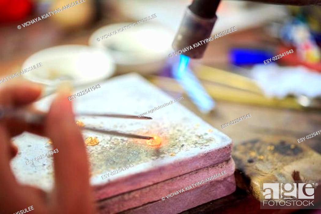 Stock Photo: Goldsmith making gold.