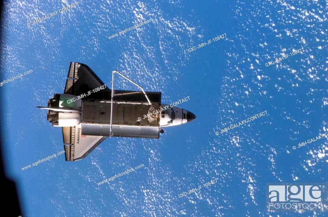 Stock Photo: Backdropped by a blue and white Earth, Space Shuttle Discovery is featured in this image photographed by an Expedition 16 crewmember after the shuttle undocked.