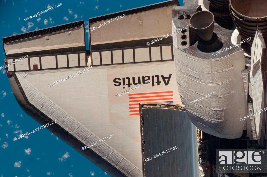 Stock Photo: An overhead view of part of the Space Shuttle Atlantis' starboard wing and part of its orbital maneuvering system pods was provided by Expedition 16 crewmembers.