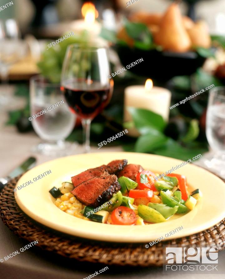 Stock Photo: Sliced Beef Over Tomato and Corn Salad with Red Wine.