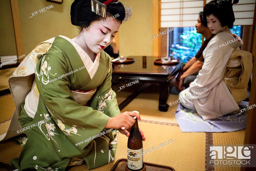 Stock Photo: Fukukimi, 'maiko' geisha apprentice workimg in Miyaki tea house o-chaia Geisha's distric of Miyagawacho Kyoto  Kansai, Japan.
