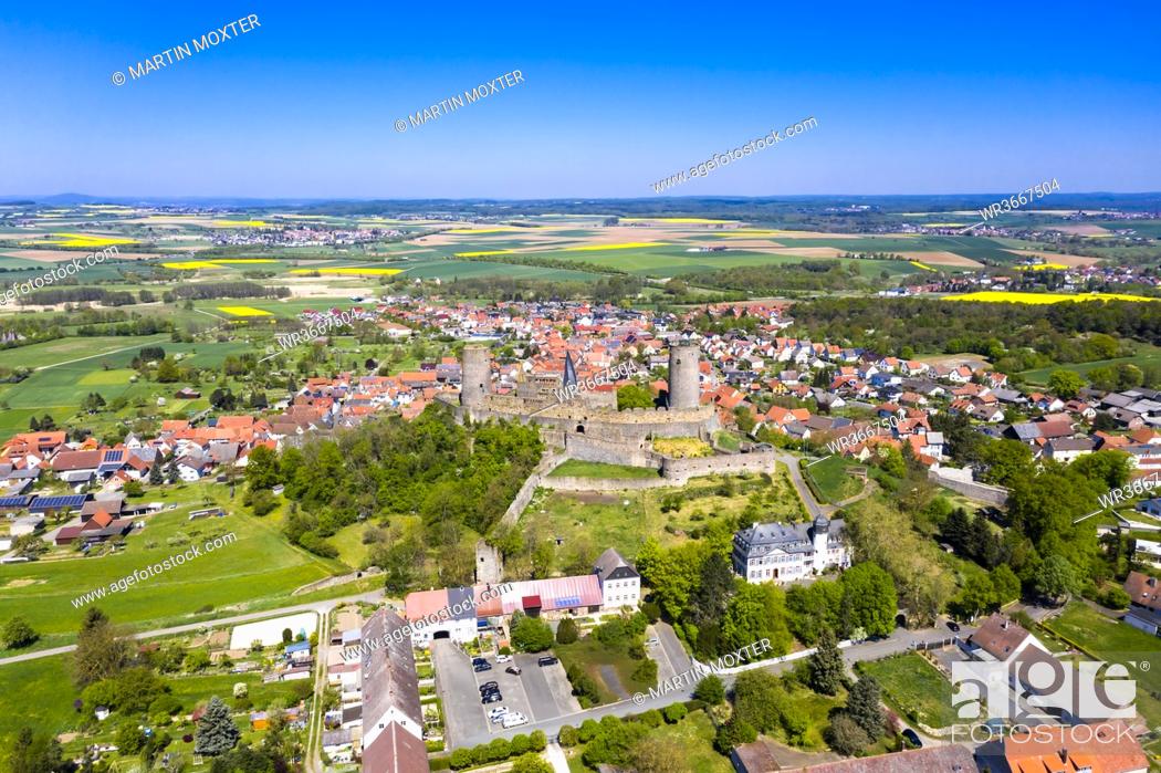 Stock Photo: Germany, Hesse, Munzenberg, Helicopter view of Munzenberg Castle and surrounding village in summer.