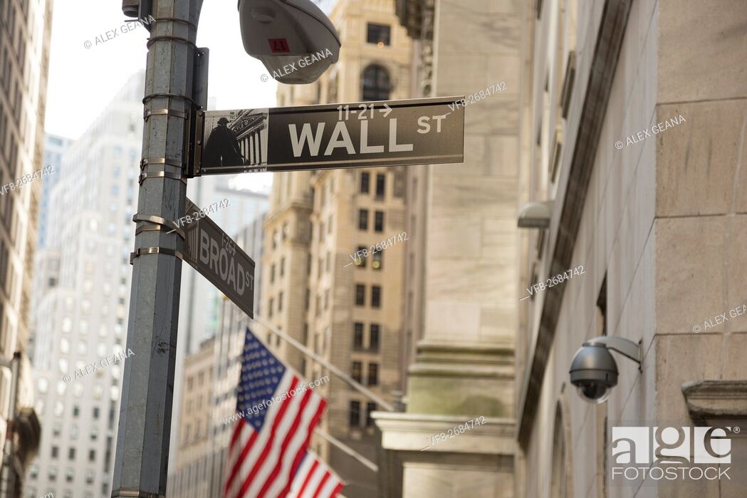 Stock Photo: The iconic street in New York has become the symbol for money, power and finance. The new signage was part of a recent move to update city streets.
