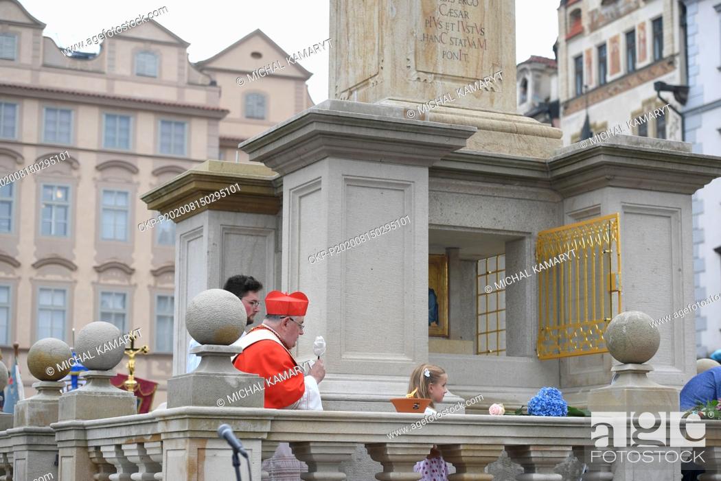 Stock Photo: Prague Archbishop Cardinal Dominik Duka blesses the revived Virgin Mary column, a replica of the original 17th-century baroque artifact that was demolished by a.