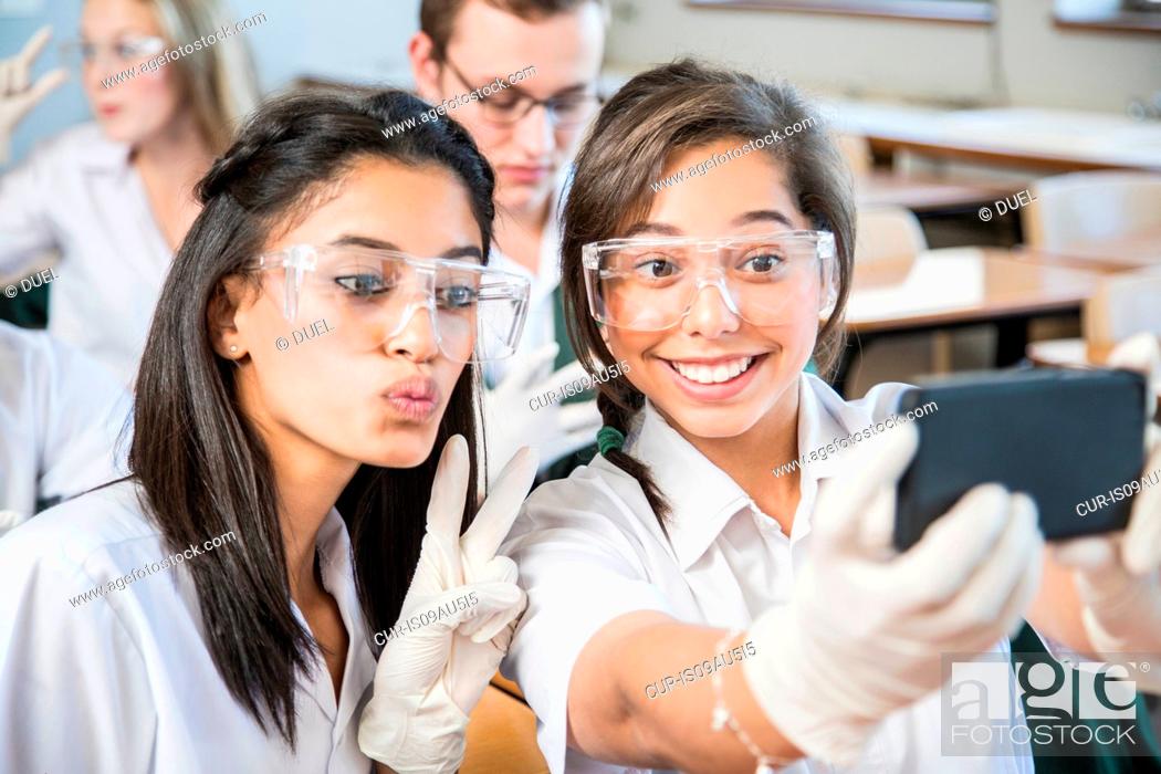 Stock Photo: Students taking selfie in lab.