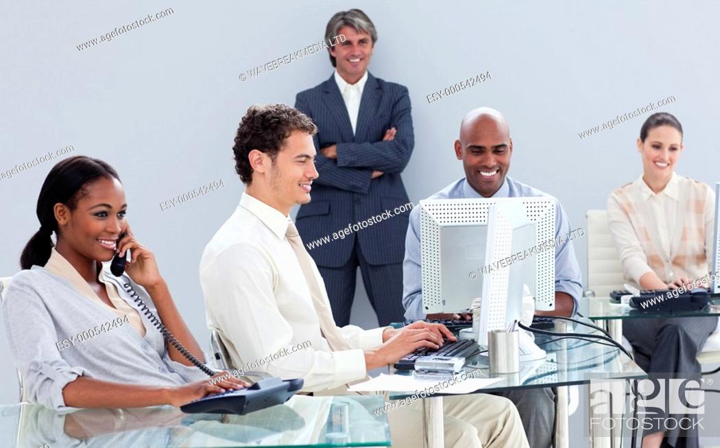 Stock Photo: Presentation of a business team working hard in the office.