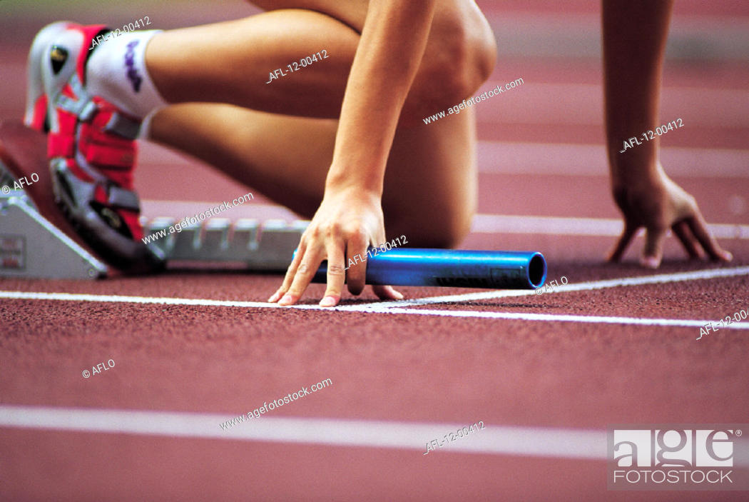Stock Photo: Close-Up, Lower, Course, 20'S, Outdoors, Relay-Baton, One, Sport, Young, Horizontal, Body, Teenager, Lane, Start, Field, Track, Color Image, Competitive, Starting, Professional, Crouching, Day, Relay-Race, Block, Athletics, Event