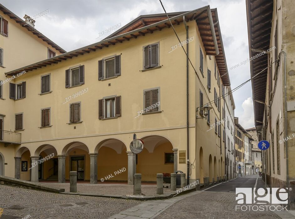Stock Photo: cityscape with old house with arched arcade, shot in bright light on Sebino lake at Lovere, Bergamo, Lombardy, Italy.