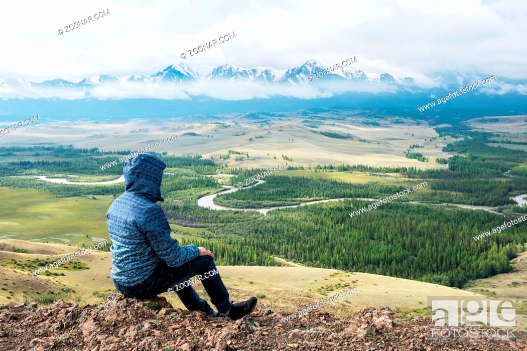 Stock Photo: Man watching to glacier in Altai mountains. Resting in mountains or global warming concept.