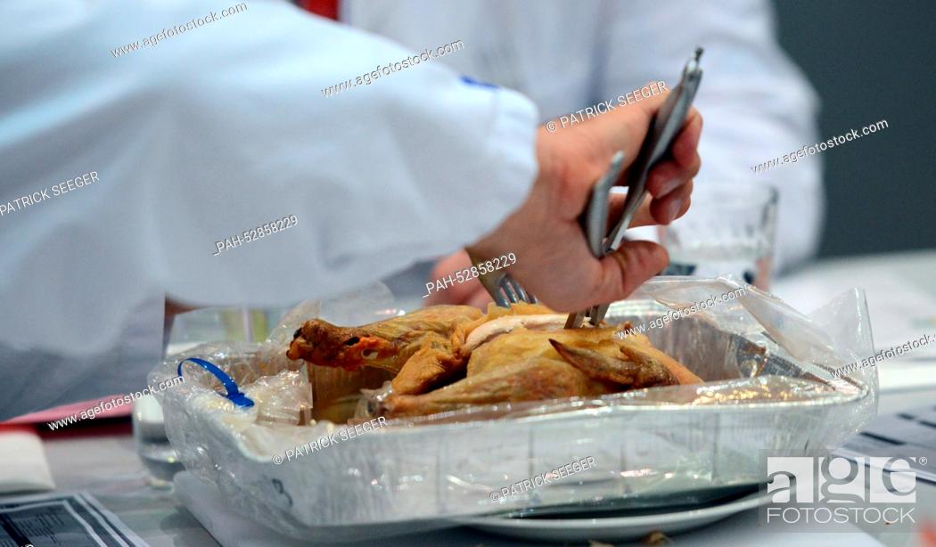 Stock Photo: Inspectors from the German Agricultural Society (DLG) examining food in the Baden Arena in Offenburg,  Germany, 14 October 2014.