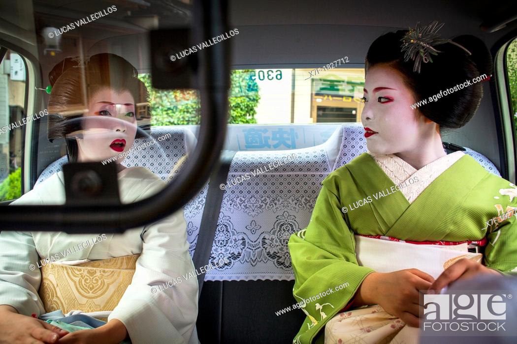 Stock Photo: Fukuyu, geisha and Fukukimi, 'maiko' geisha apprenticein taxi going to work Geisha's distric of Miyagawacho Kyoto  Kansai, Japan.
