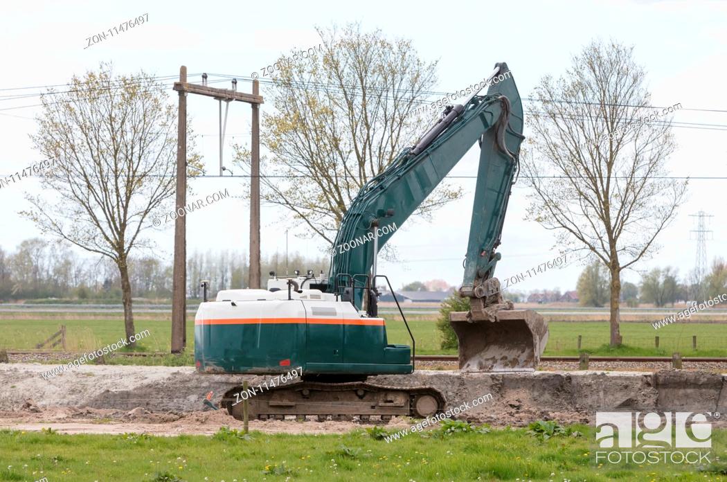 Stock Photo: Excavator in construction site in the Netherlands.
