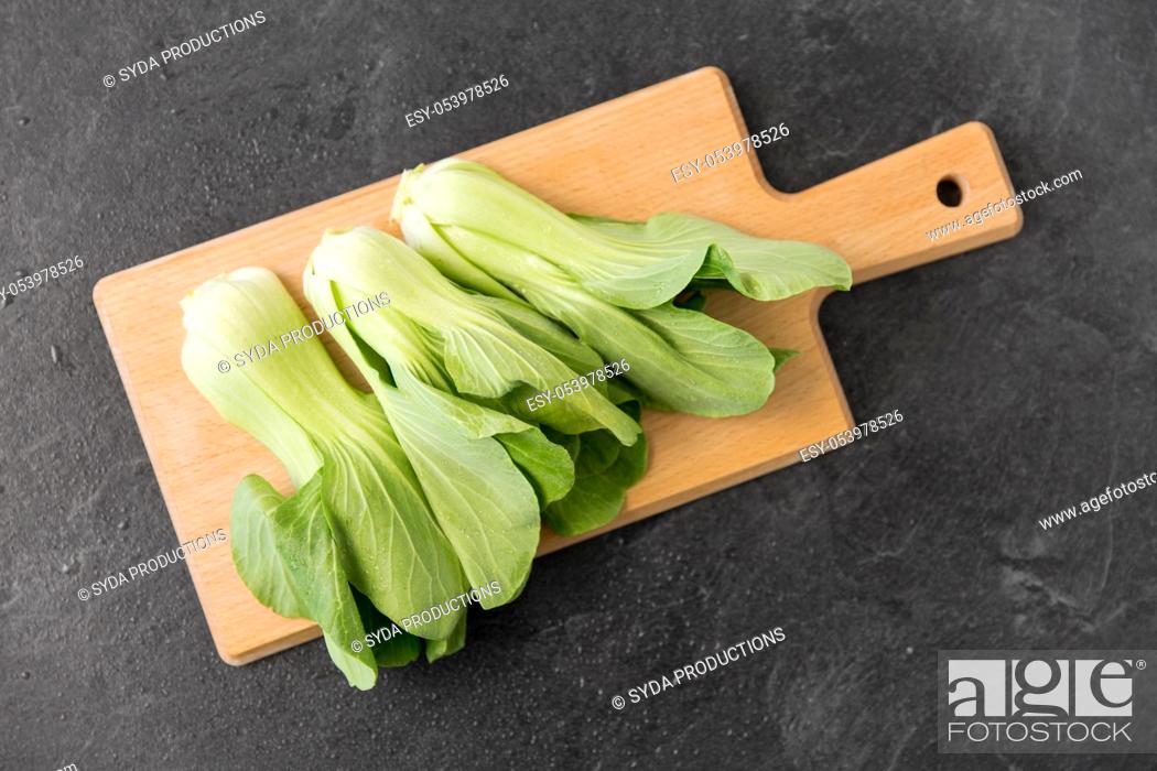 Stock Photo: bok choy chinese cabbage on wooden cutting board.