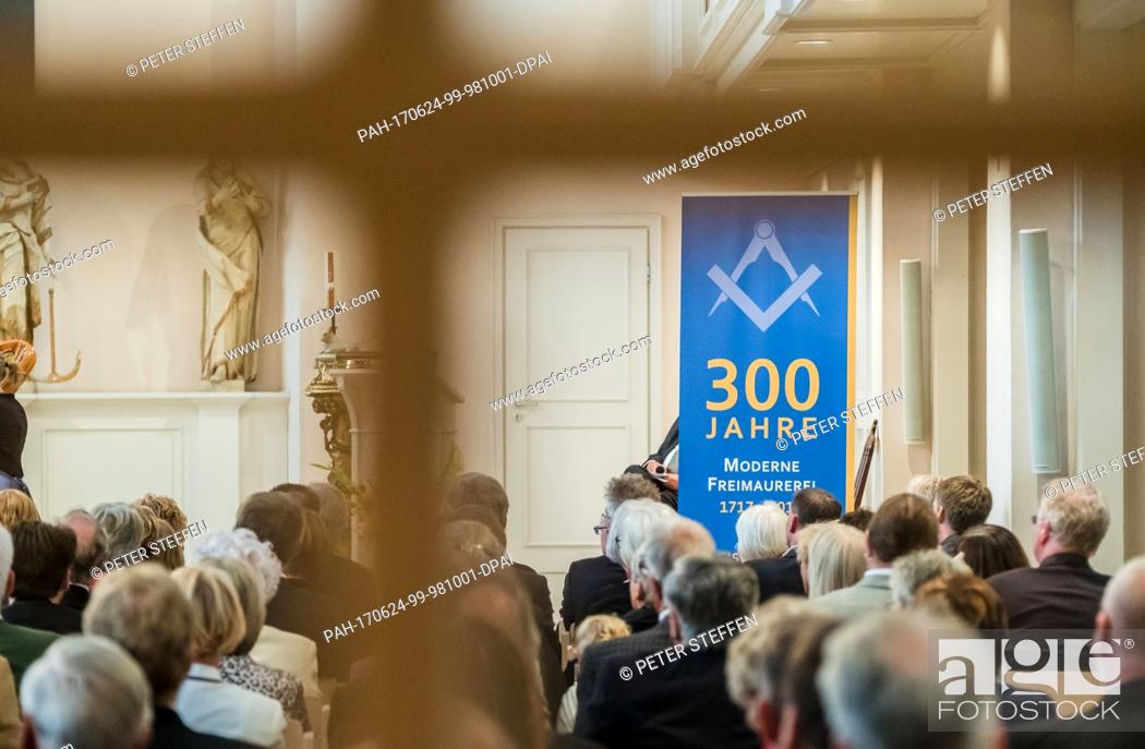Stock Photo: Visitors attend a public event celebrating three hundred years of Freemasonry in the St. Johannis Church in Hanover, Germany, 24 June 2017.