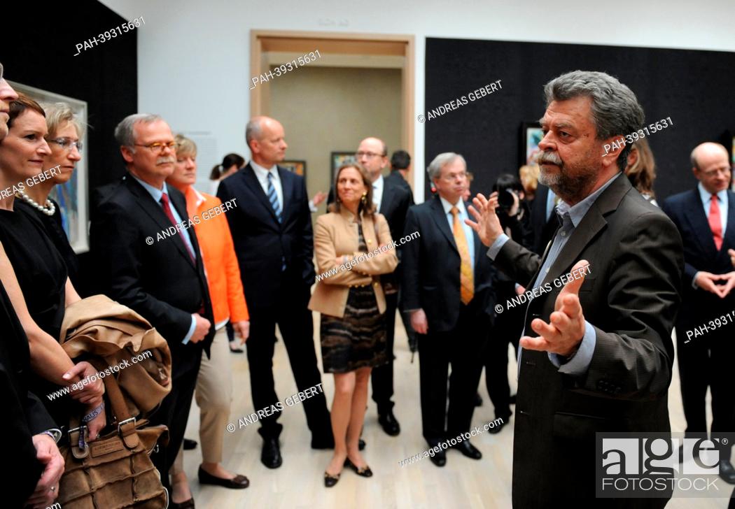 Stock Photo: Director of the Lenbachhaus Helmut Friedel (R) talks to guests during the re-opening ceremony for the renovated Lenbachhaus in Munich,  Germany, 07 May 2013.