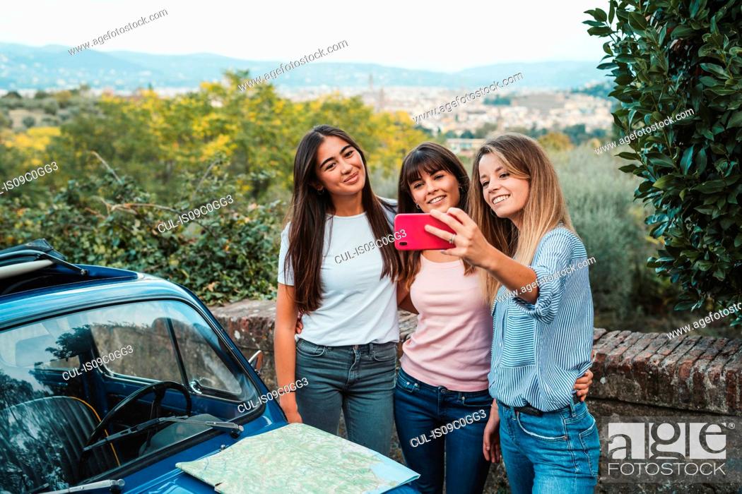 Stock Photo: Friends taking selfie in countryside, Florence, Toscana, Italy.
