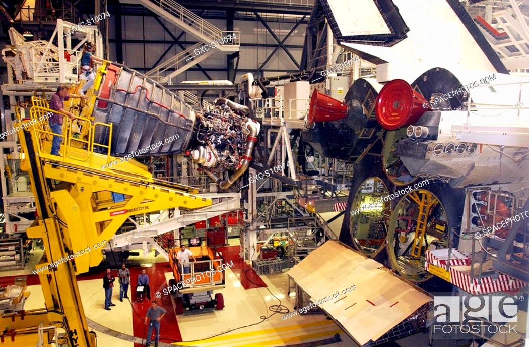 Stock Photo: 08/16/2002 -- The first Space Shuttle Main Engine SSME is installed on Space Shuttle Atlantis following the welding repair of the propulsion system flow liners.