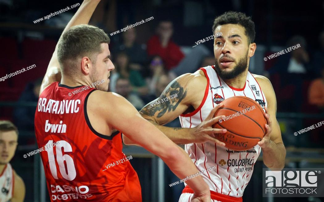 Stock Photo: Oostende's Haris Bratanovic and Spirou's Jito Kok fight for the ball during the basketball match between Spirou Charleroi and BC Oostende.